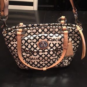 Black and white coach bag with tan leather straps